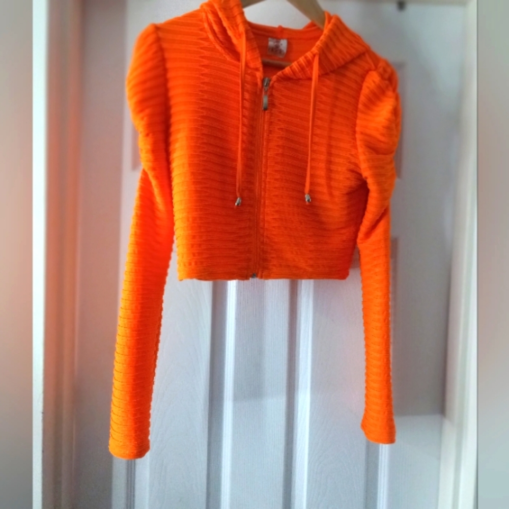 Neon orange cropped hoodie with drawstring and ruched sleeves. Cute!